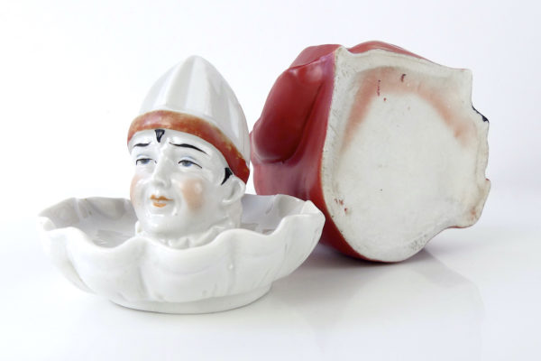 Ancien presse citron Clown complet en porcelaine et biscuit (dessous ouvert)