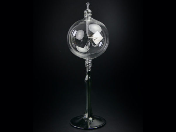 Radiomètre de Crookes en verre sur long pied de couleur verte (face)