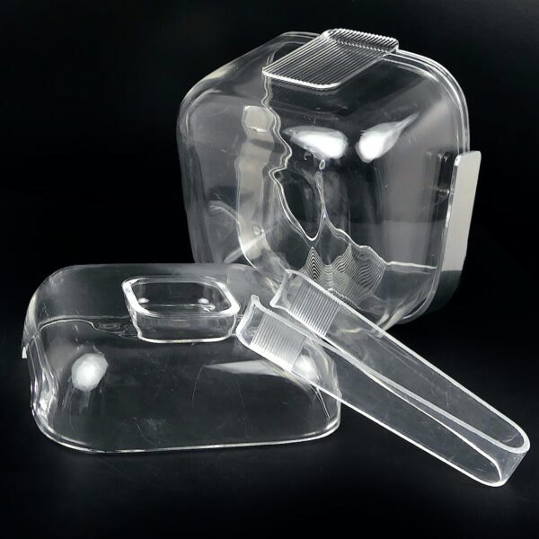 Bac à glaçons Guzzini en plastique transparent et sa pince Space Age 70 (ouvert dessous)